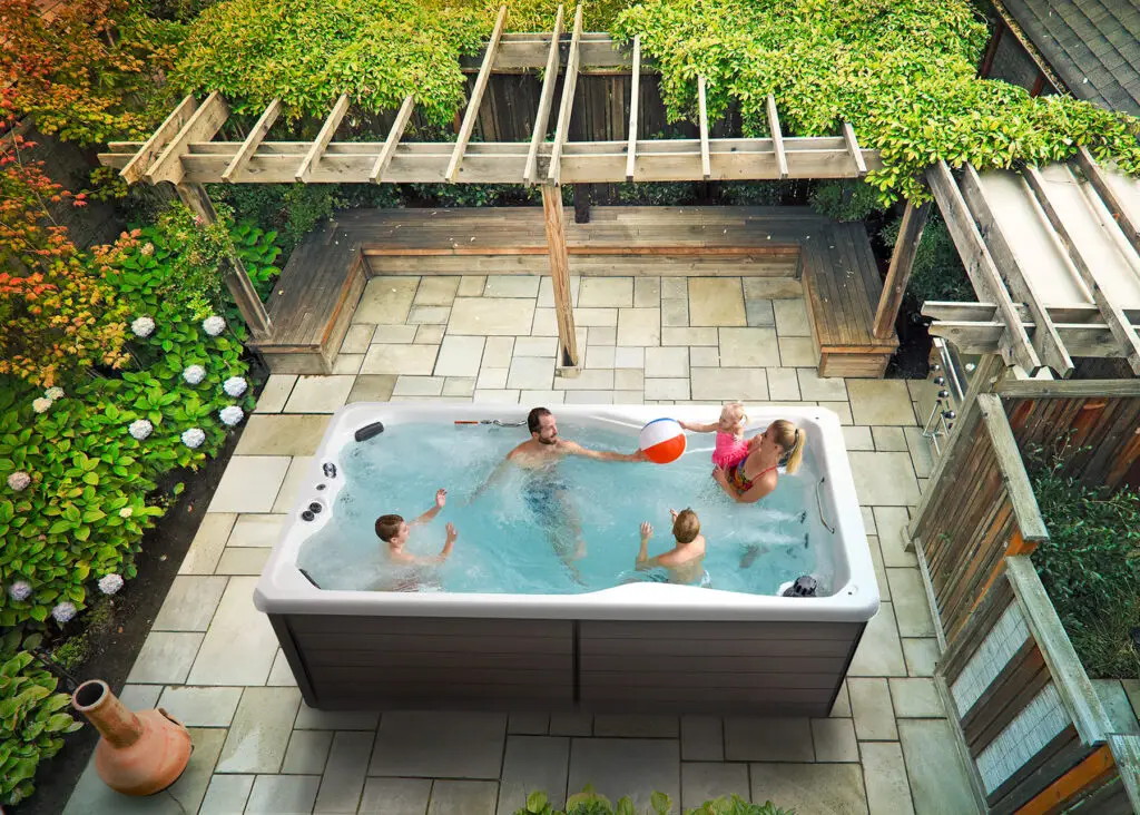 Happy family swimming in a freshly resurfaced pool in North Port, Florida.