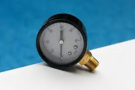 Technician checking pool filter gauge.